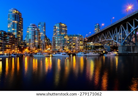 Vancouver BC Canada Skylines next to Granville Bridge along False Creek at Night. Vancouver is the third most populous metropolitan area and is the most ethnically diverse cities in Canada.