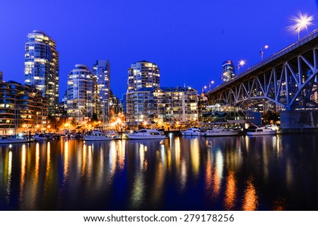 Vancouver BC Canada Skylines next to Granville Bridge along False Creek at Night. Vancouver is the third most populous metropolitan area and is the most ethnically diverse cities in Canada.