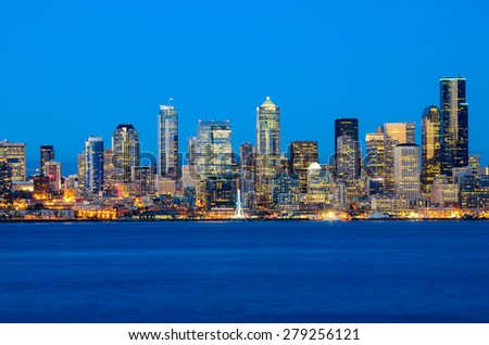 Seattle skylines in blue hour from Alki Beach, West Seattle, Washington, USA.