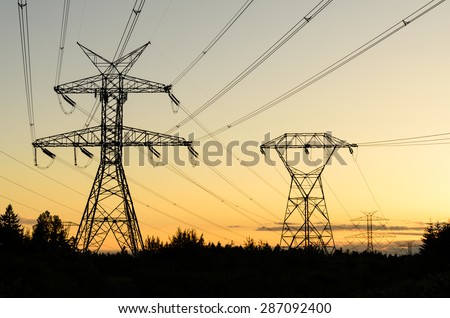 Pylon high voltage power lines silhouette in sunset at Fairwood, King County, Washington State, USA