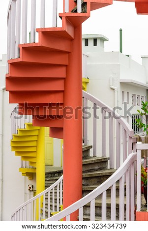 Colorful spiral staircases at the back of traditional Chinese shop houses in Bugis Village, Singapore. Colorful urban and cityscape concept
