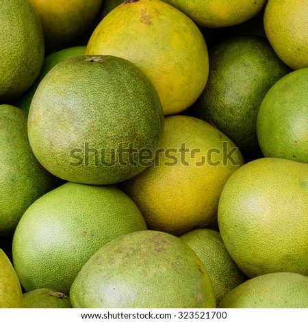 Group of fresh pomelo (Citrus maxima or Citrus grandis) fruits on display at the fruits stall at Bugis Village wet market, Singapore