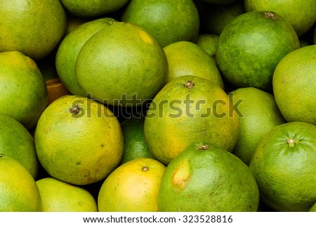 Group of fresh pomelo (Citrus maxima or Citrus grandis) fruits on display at the fruits stall at Bugis Village wet market, Singapore
