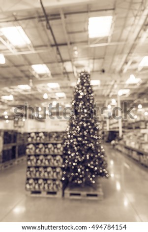 blurred image huge christmas tree decoration in wholesale store wreaths and strings of bokeh light - Wholesale Vintage Christmas Decorations blurred image huge christmas tree decoration in wholesale store wreaths and strings of bokeh light - Wholesale Vintage Christmas Decorations