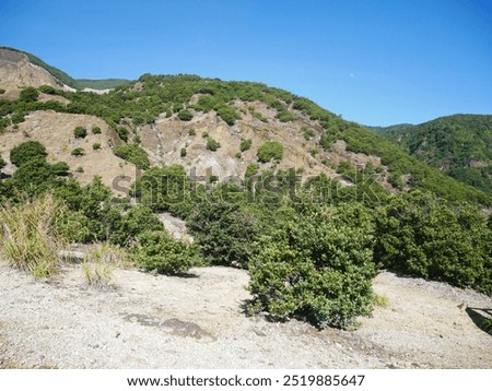 Similar – Foto Bild warm angestrahlter Felsen vor blauem Himmel