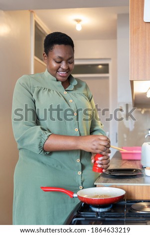 Similar – Image, Stock Photo Woman seasoning food with salt