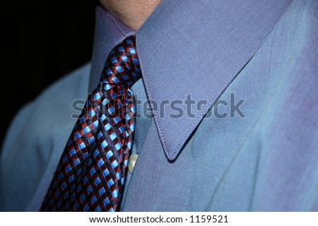 Mans blue dress shirt and tie