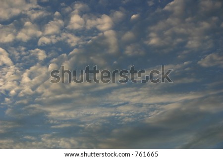Pale blue sky with white clouds.