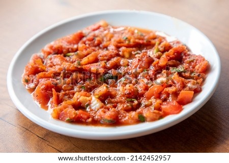 A spicy Turkish appetizer ezme made with tomatoes, bell pepper, parsley, mint, olive oil and hot chili. Stok fotoğraf © 