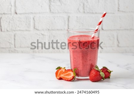 Similar – Image, Stock Photo Strawberry smoothie in a botle with pink background and pink paper straws.