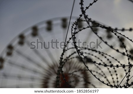 Similar – Image, Stock Photo barbed wire and carousel in amusement park in Chernobyl