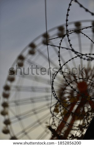 Similar – Image, Stock Photo barbed wire and carousel in amusement park in Chernobyl