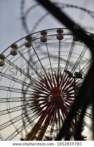 Similar – Image, Stock Photo barbed wire and carousel in amusement park in Chernobyl