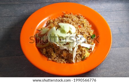 Nasi goreng tek-tek or abang-abang or street culinary  fried rice  isolated on wooden background Stok fotoğraf © 