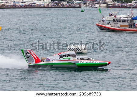 DETROIT - JULY 12: The Oberto hydroplane crosses the finish line at the APBA Gold Cup July 12, 2014 on the Detroit River in Detroit, Michigan.