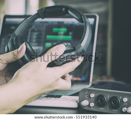 Similar – Image, Stock Photo Working sound engineer wearing headphone in home studio.