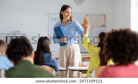 Similar – Image, Stock Photo Little smiling girl learning horseback riding