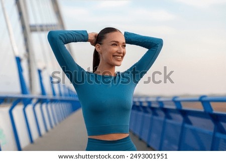 Similar – Image, Stock Photo Woman athlete standing stretching on yoga mat after training