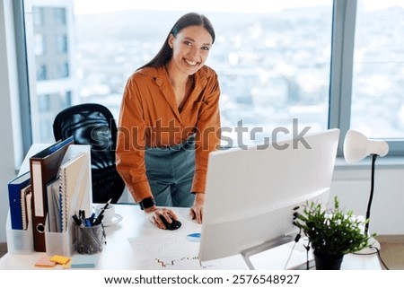 Similar – Image, Stock Photo Smiling businesswoman standing near gray wall