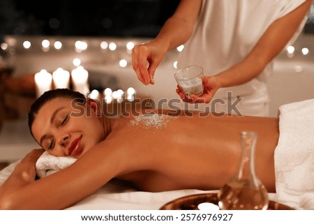 Similar – Image, Stock Photo Relaxed woman applies mineral clay mask on face for rejuvenation, has headband on head