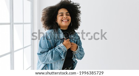 Similar – Image, Stock Photo Happy plus size curly young woman smiling to camera while using a laptop to prepare,and do work online at home, remote tasking. Modern city flat. Getting the bills paid. Entrepreneur freelancer women