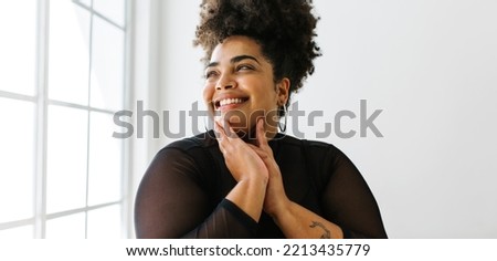 Similar – Image, Stock Photo Happy plus size curly young woman smiling to camera while using a laptop to prepare,and do work online at home, remote tasking. Modern city flat. Getting the bills paid. Entrepreneur freelancer women