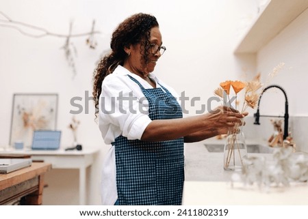 Similar – Image, Stock Photo Beautiful happy craft woman wearing apron looking at camera and smiling while standing in her art studio or craft pottery shop