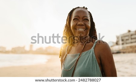 Similar – Image, Stock Photo Smiling senior woman at home looking at camera