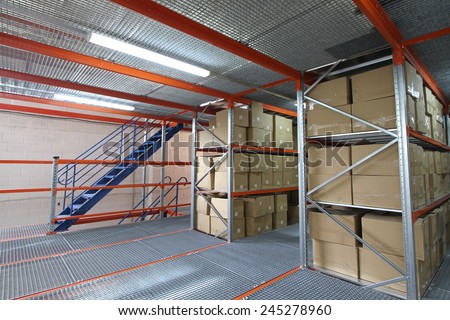 Shelving System with cardboard boxes and a metal ladder