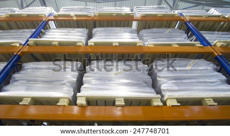 Row of the pallet metal racks with a heavy load in large modern