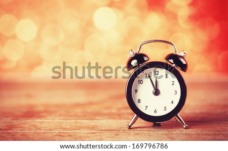 Retro alarm clock. Photo in retro color image style