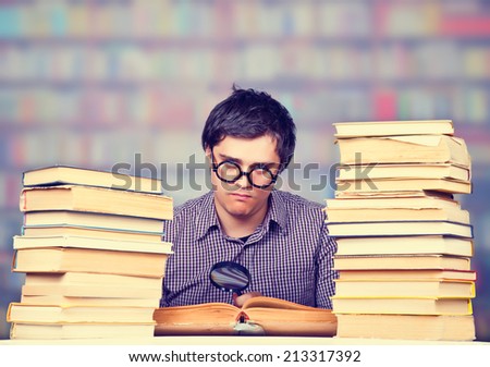 The young student with the books isolated. Studio shot.