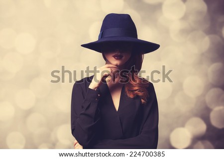 Style redhead women in black on classic background