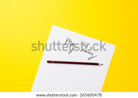 Inscription on a paper and pencil on yellow background