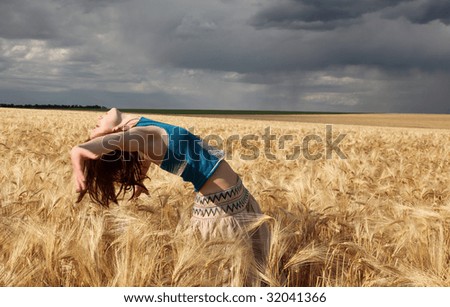 beautiful girl at wheat field in rainy day