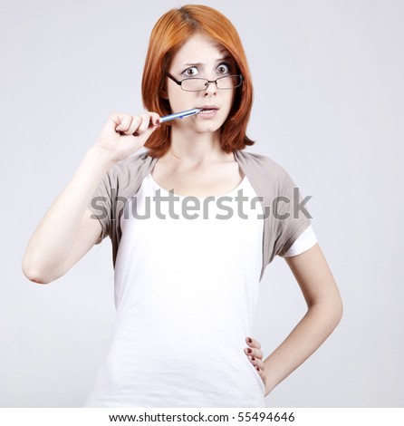 Young businesswomen with pen in hand