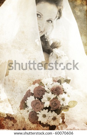 Bride holding beautiful red roses wedding flowers bouquet. Photo in old colour image style.