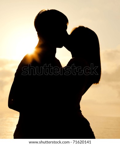 Couple Kissing In Sunrise At The Beach. Stock Photo 71620141 : Shutterstock