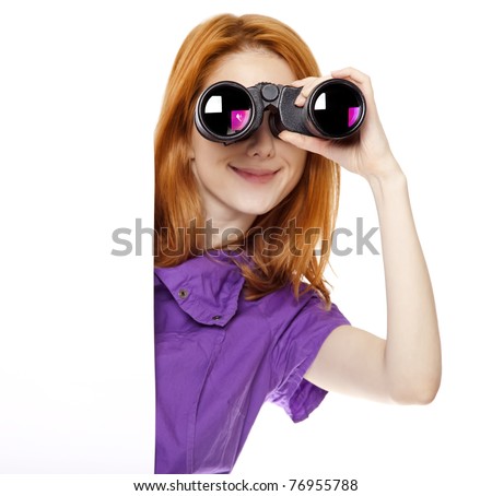 Teen redhead girl with binoculars isolated on white background