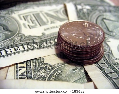 Quarters on dollar bill