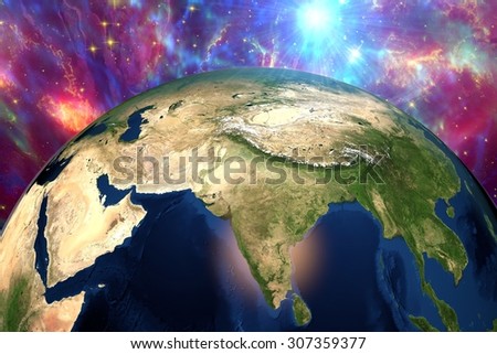 The Earth from space showing India and Arabian peninsula on surrealistic background with stars and galaxies, elements of this image furnished by NASA, other orientations available