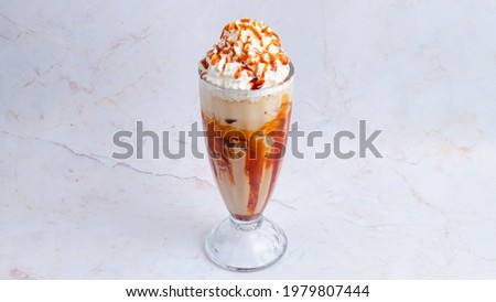 Similar – Image, Stock Photo Salted caramel frappe coffee served on glass