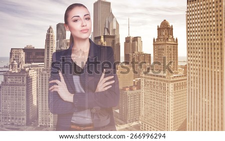 Double exposure city and beautiful business woman folded her arms