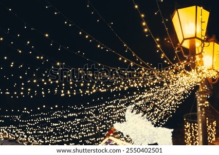 Similar – Image, Stock Photo Lights hang overhead on a clear summer evening