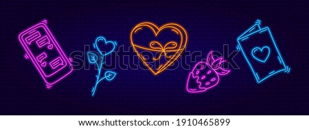 3d neon signboard. Neon design elements Strawberries, Rose, Telephone, box of chocolates and a card. Modern trend style. Bright signboard and design elements for postcards, banners. Valentine's Day.