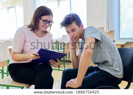Woman school psychologist talking and helping student, teenage boy. Mental health of adolescents, psychology, social issues, professional help of counselor