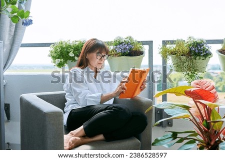 Similar – Image, Stock Photo balcony Reading Literature