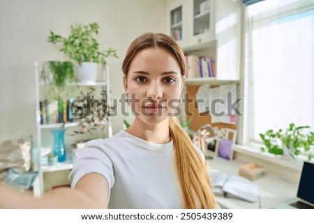 Similar – Image, Stock Photo Serious attractive female teenager in studio