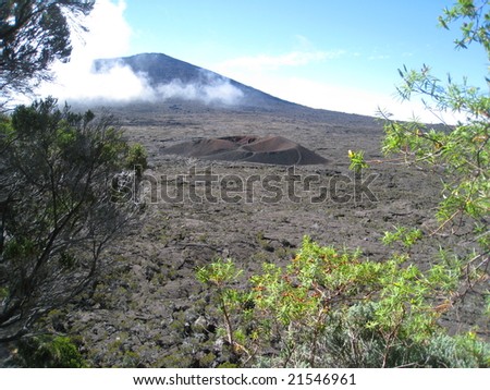 Formica Leo and Fournaise volcanoes in Reunion Island with a patch of fog in the background