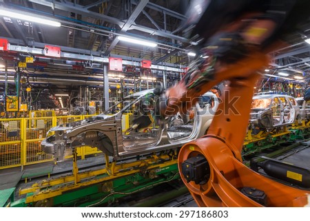TOGLIATTI, RUSSIA - NOVEMBER 13: Robots welding in a car factory. Welding car body of LADA Cars in Automobile Factory AVTOVAZ on November 13, 2013 in Togliatti